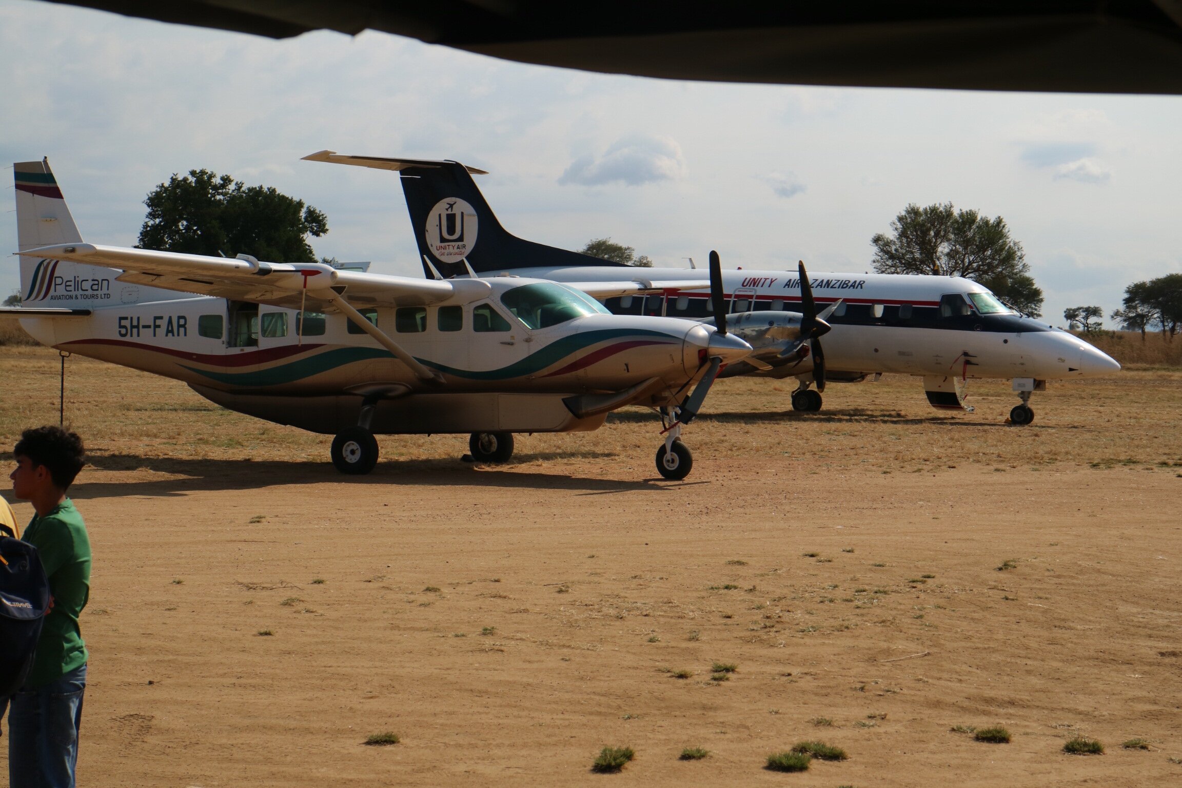 Two light aircraft parked on the bush airstrip at Mikumi